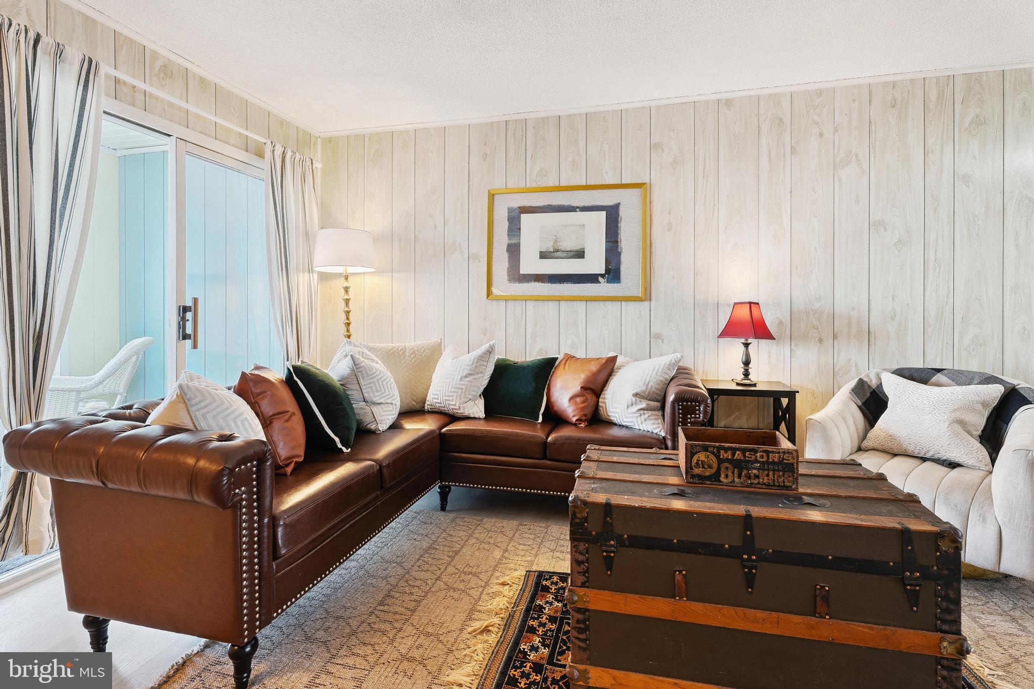120 53rd Street, Unit H30102 Ocean City, MD 21842 - Photo 5 of 53 a living room with furniture and a potted plant