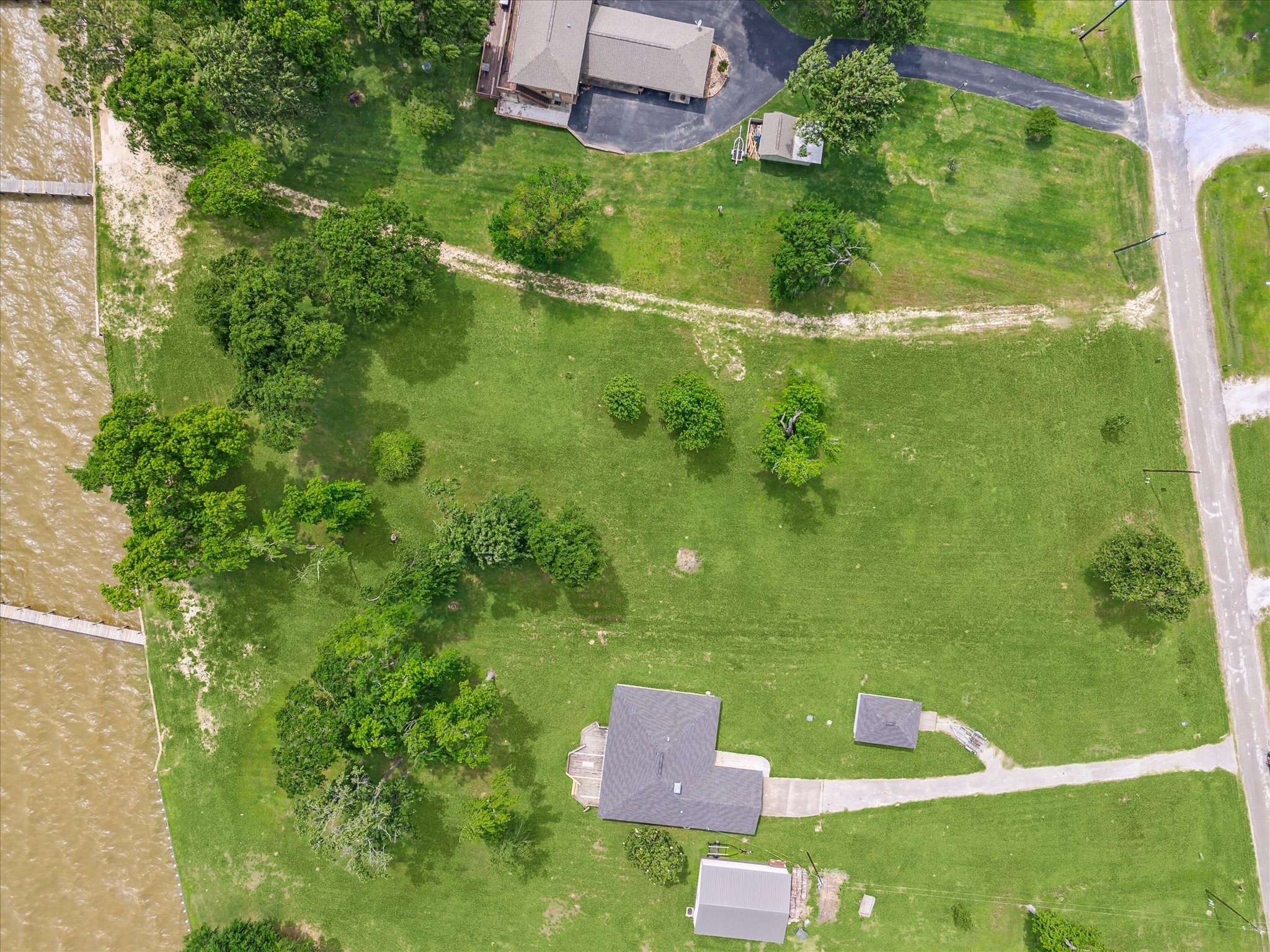 Tbd Emerald Lane Onalaska, TX 77360 - Photo 12 of 15 a view of a green yard with large trees