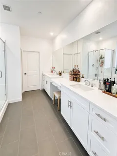 a bathroom with a tub a sink and a shower