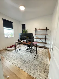 a bedroom with a bed and a couch