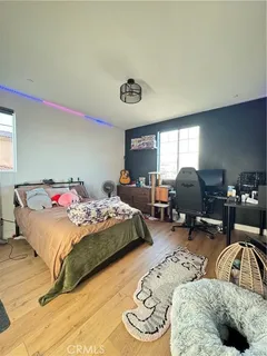 a bedroom with a bed and a couch