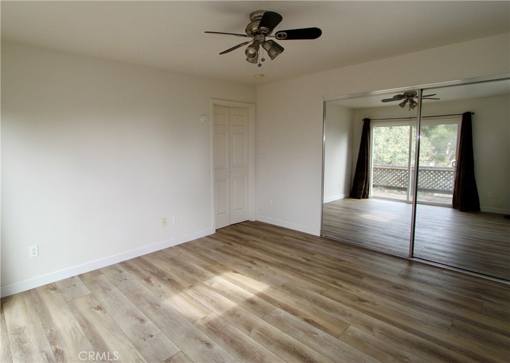 3085 Gardner Road Nice, CA 95464 - Photo 16 of 25 wooden floor in an empty room with a window