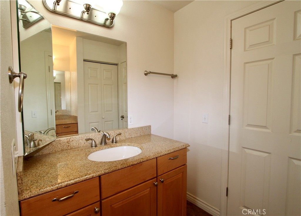 3085 Gardner Road Nice, CA 95464 - Photo 18 of 25 a bathroom with a granite countertop sink and a mirror