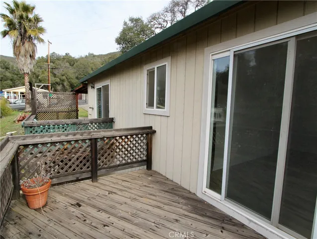 a outdoor space with sliding door and wooden floor