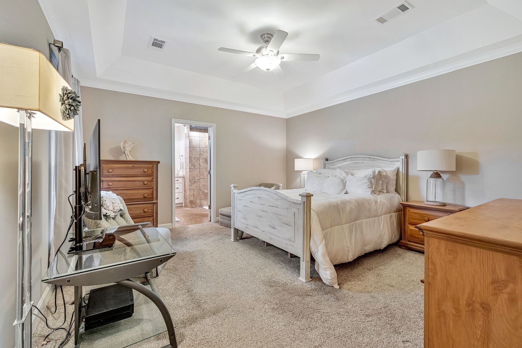529 General George Patton Road Nashville, TN 37221 - Photo 15 of 28 a bedroom with bed and a chandelier