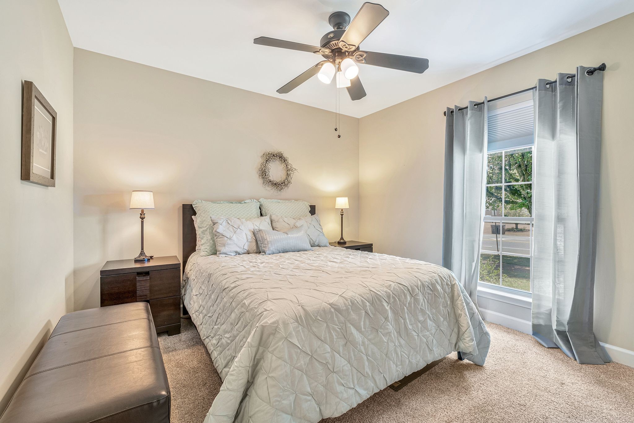 529 General George Patton Road Nashville, TN 37221 - Photo 19 of 28 a bedroom with a large bed and a chandelier