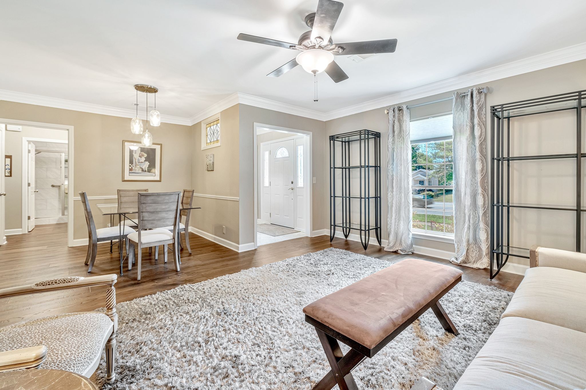 529 General George Patton Road Nashville, TN 37221 - Photo 2 of 28 a living room with furniture a wooden floor and a chandelier
