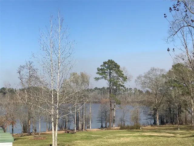 a view of a large building with large trees