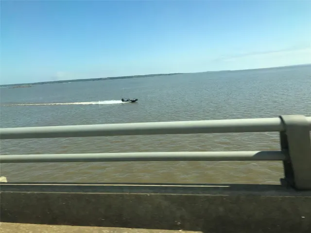 a view with a floor to ceiling window