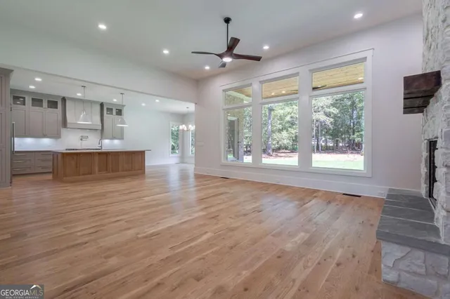 a kitchen with a stove a sink and a refrigerator