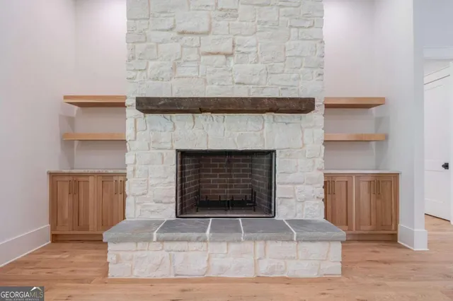 a view of a room with a sink and a chandelier