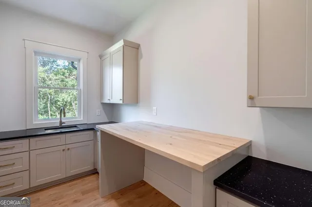 an empty room with windows and closet