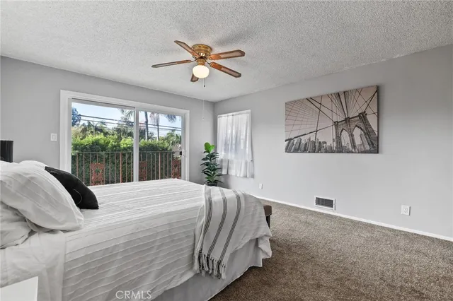 a view of a house with pool and a yard