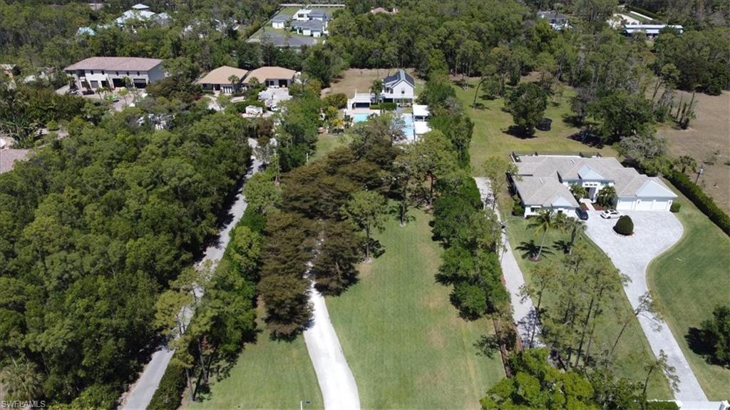 6941 Hunters Road Naples, FL 34109 - Photo 39 of 48 an aerial view of multiple house