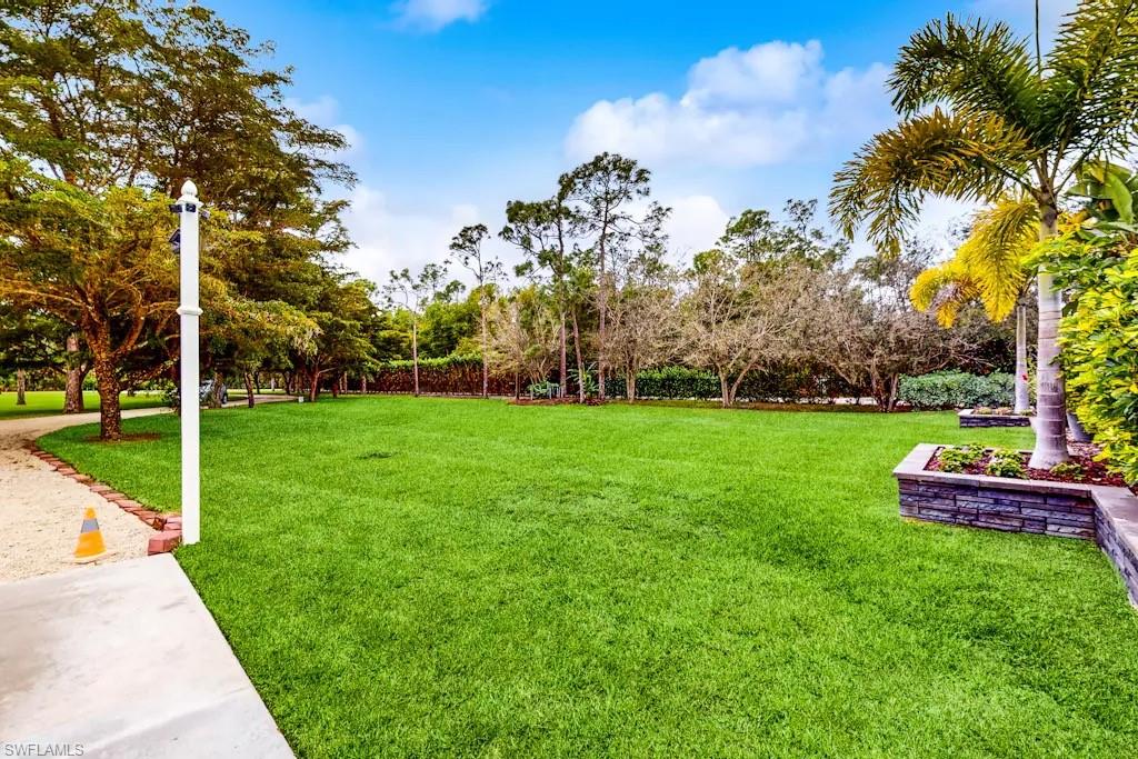 6941 Hunters Road Naples, FL 34109 - Photo 46 of 48 a view of a park with large trees