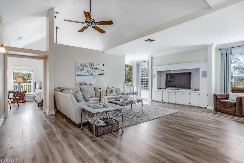 6941 Hunters Road Naples, FL 34109 - Photo 8 of 48 a living room with furniture and a flat screen tv