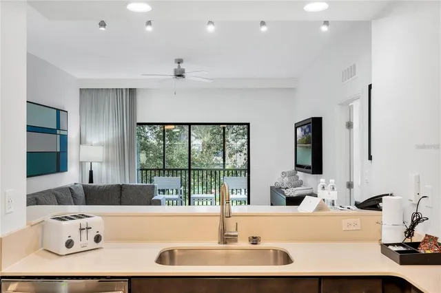 a kitchen with a refrigerator and a sink