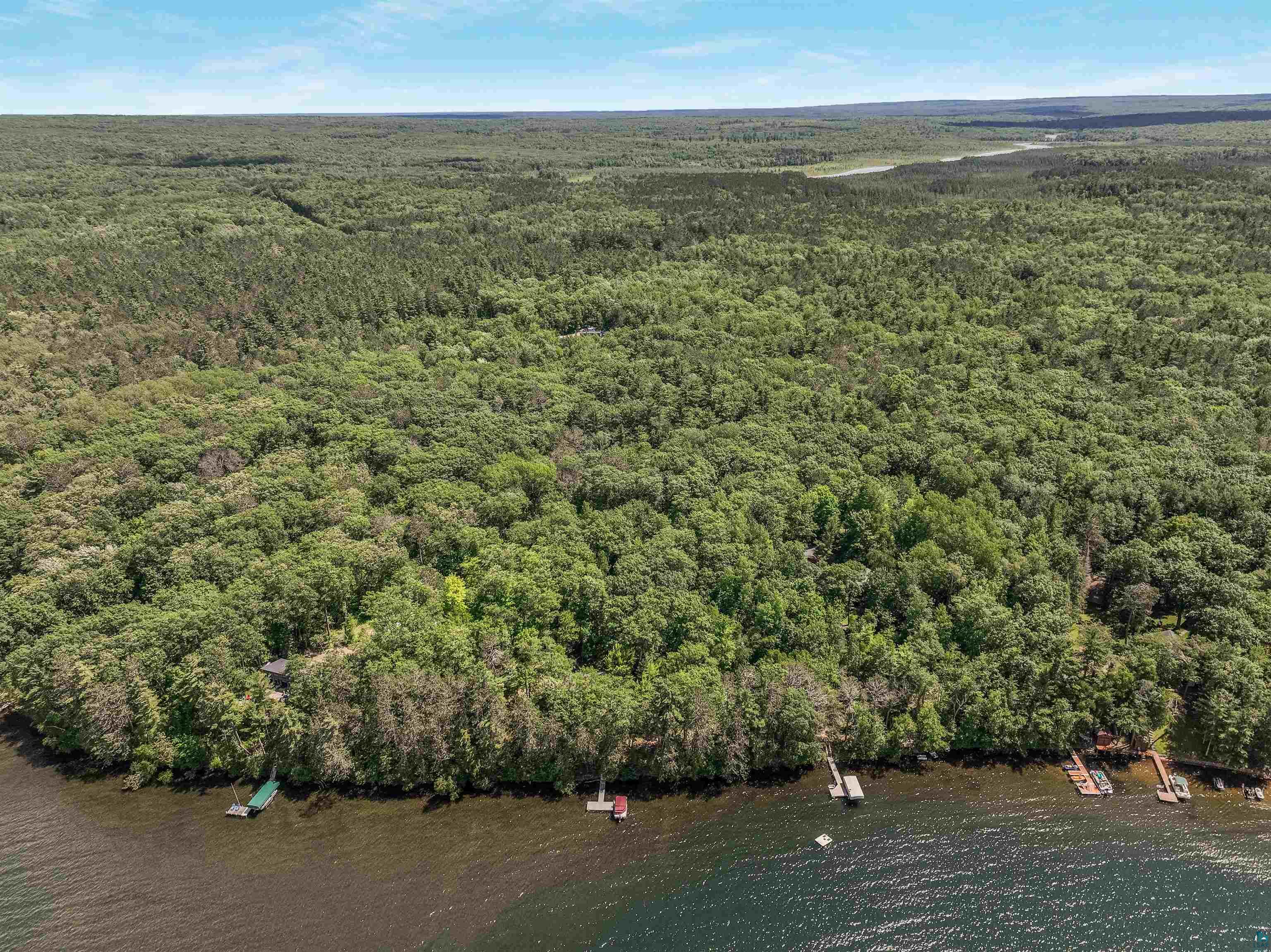 Lot 2 Thoroughfare Road Stone Lake, WI 54876 - Photo 7 of 13 Aerial view of property and surrounding area featuring a forest