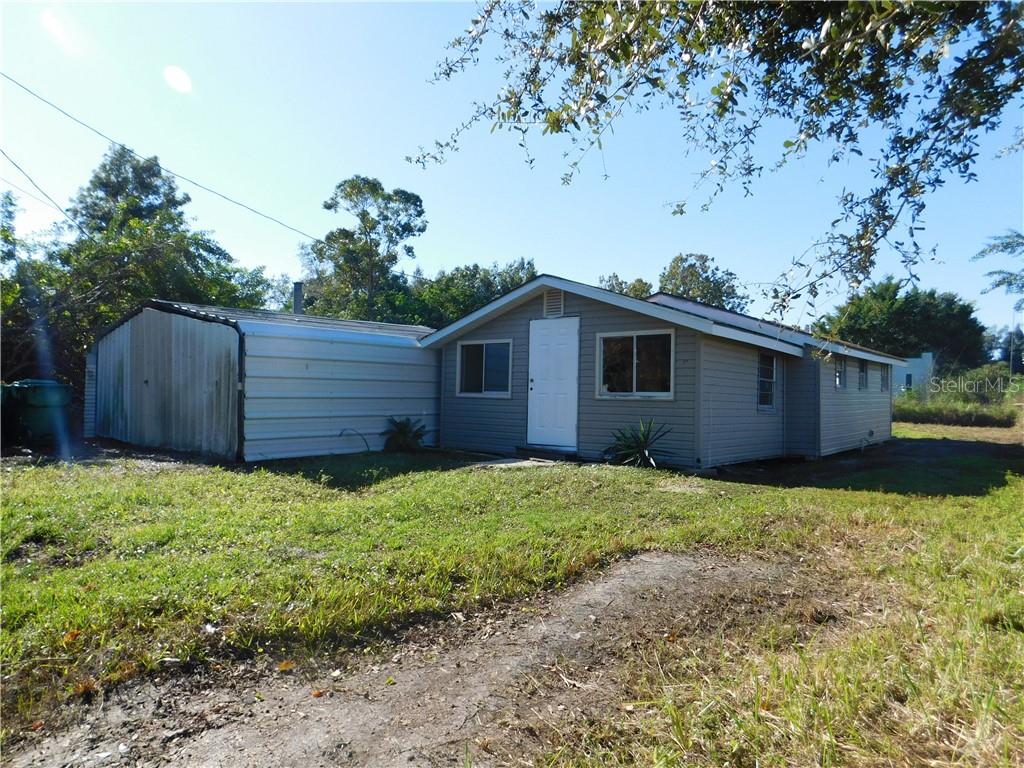 a backyard of a house with lots of green space