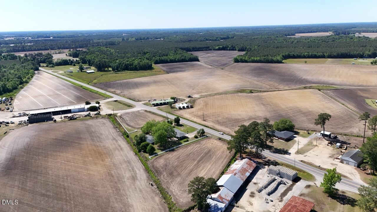 0 Us Highway Dunn, NC 28334 - Photo 19 of 27 an aerial view of a house with a yard and lake view