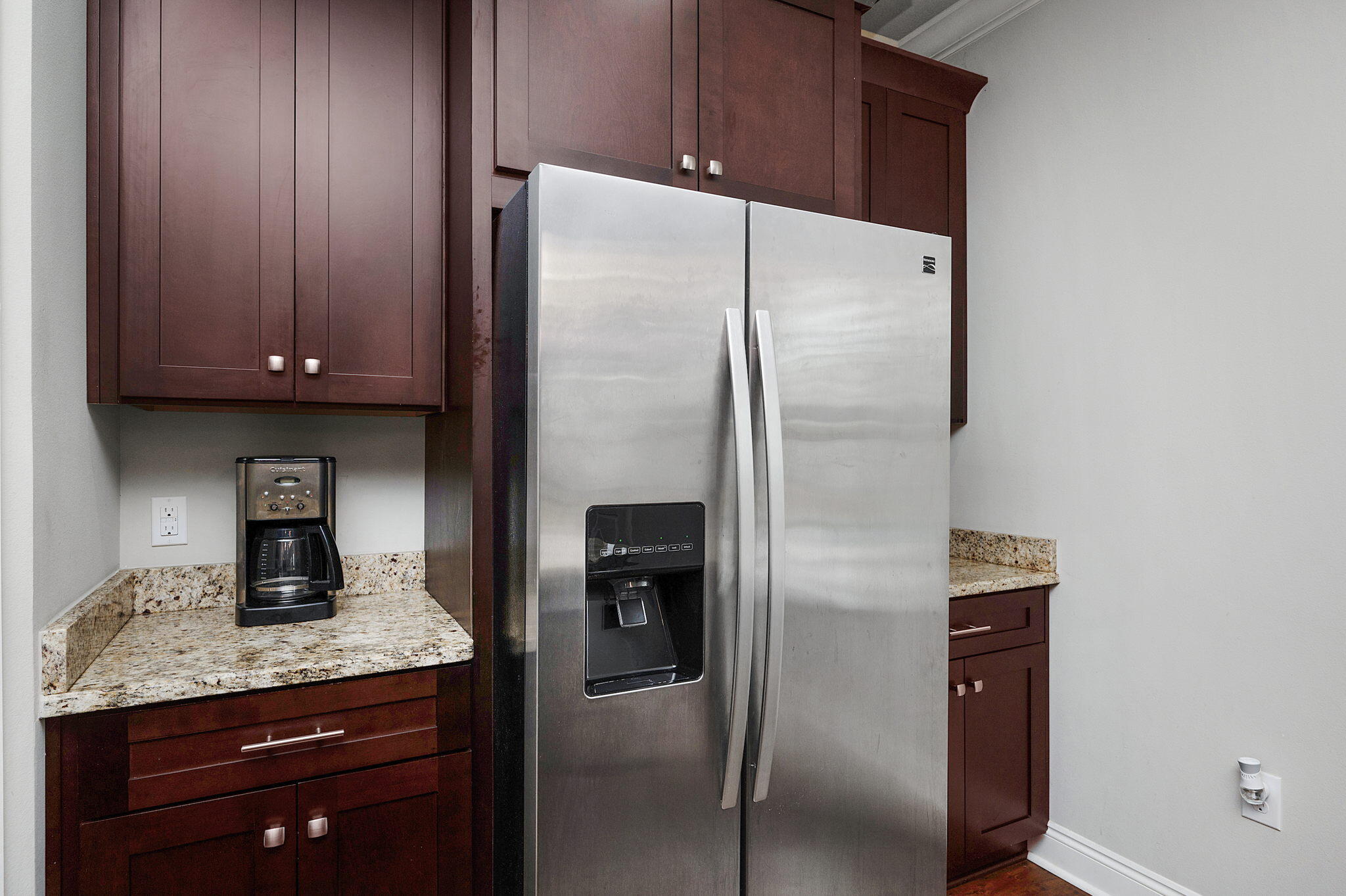 9018 Timber Lane Navarre, FL 32566 - Photo 11 of 39 a kitchen with a refrigerator and cabinets