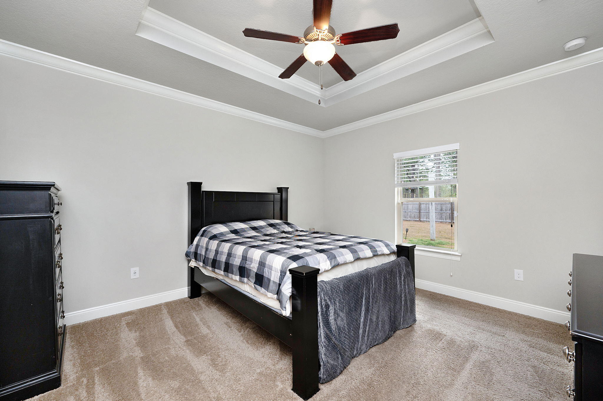 9018 Timber Lane Navarre, FL 32566 - Photo 13 of 39 a bedroom with a bed and a window
