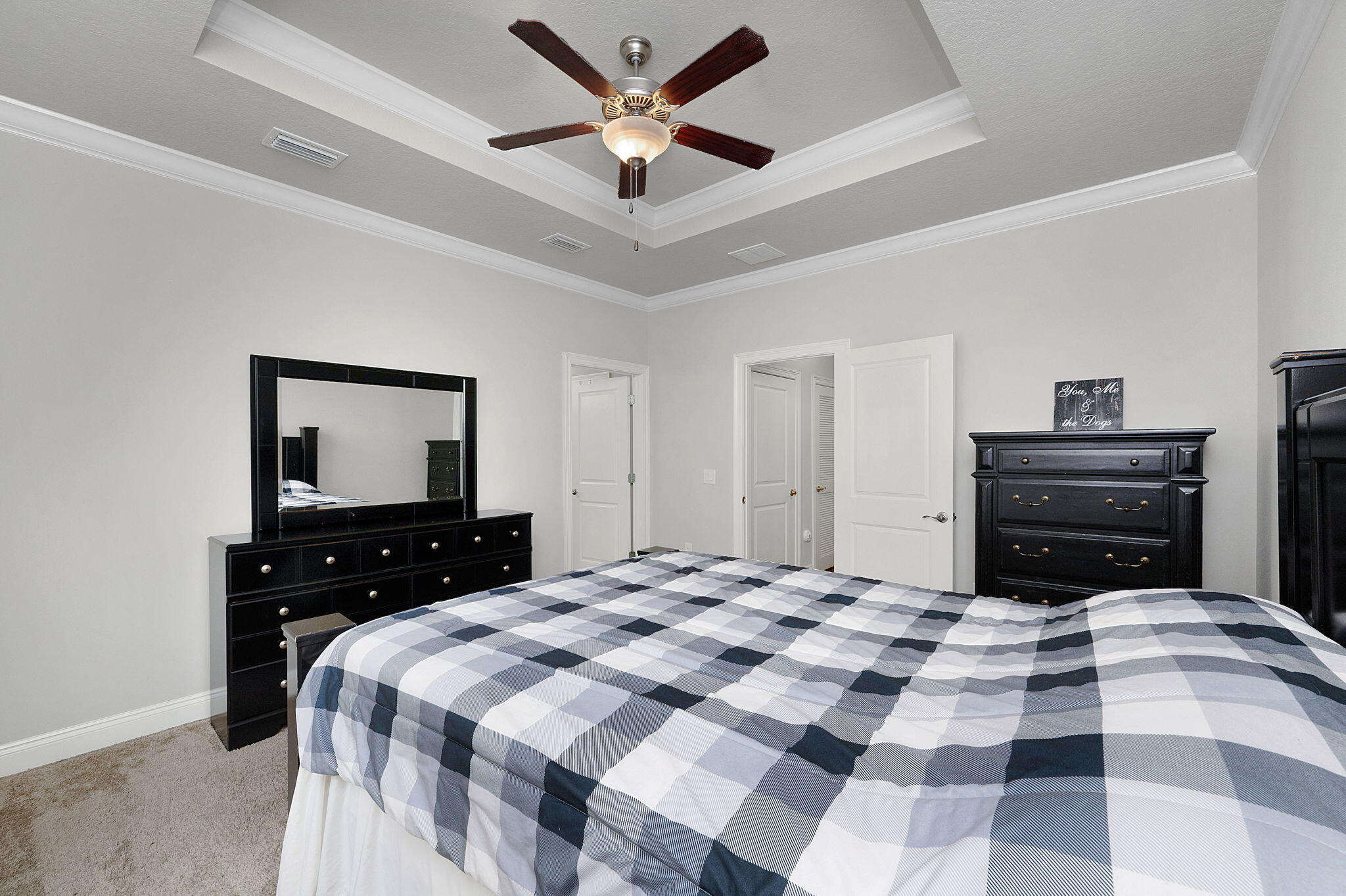 9018 Timber Lane Navarre, FL 32566 - Photo 14 of 39 a bedroom with a bed and a dresser