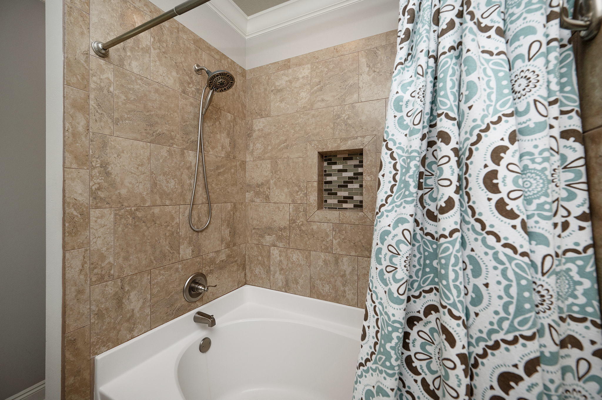 9018 Timber Lane Navarre, FL 32566 - Photo 17 of 39 a bathroom with a bathtub and shower