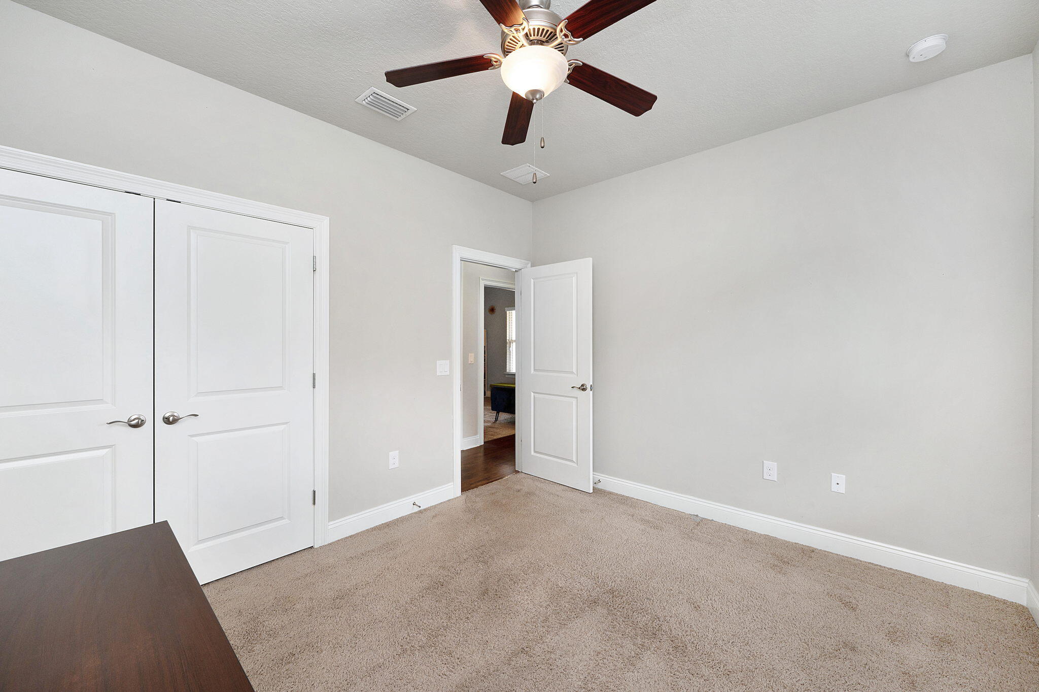 9018 Timber Lane Navarre, FL 32566 - Photo 22 of 39 a view of an empty room and chandelier fan