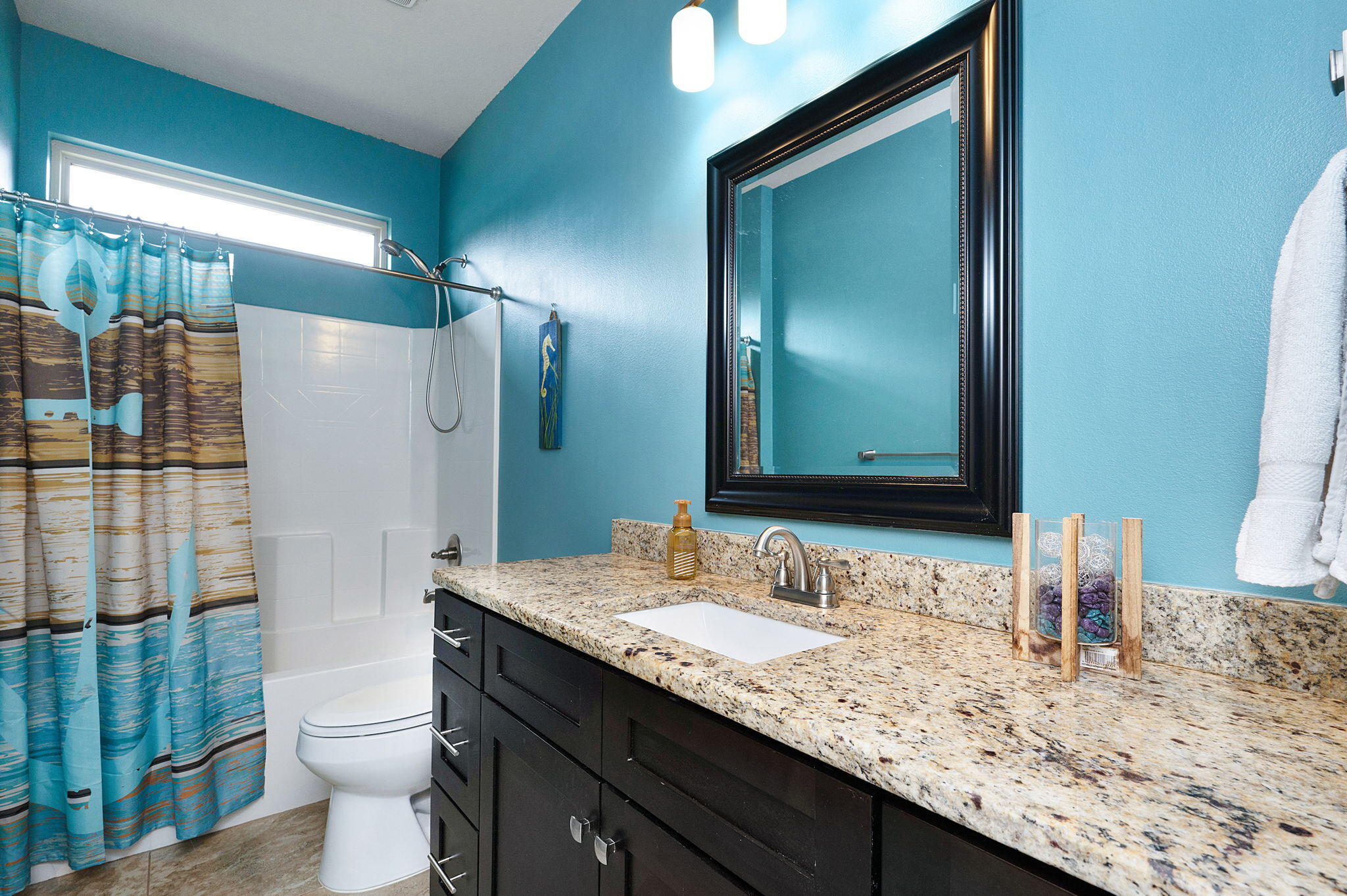 9018 Timber Lane Navarre, FL 32566 - Photo 25 of 39 a bathroom with a granite countertop sink and a mirror