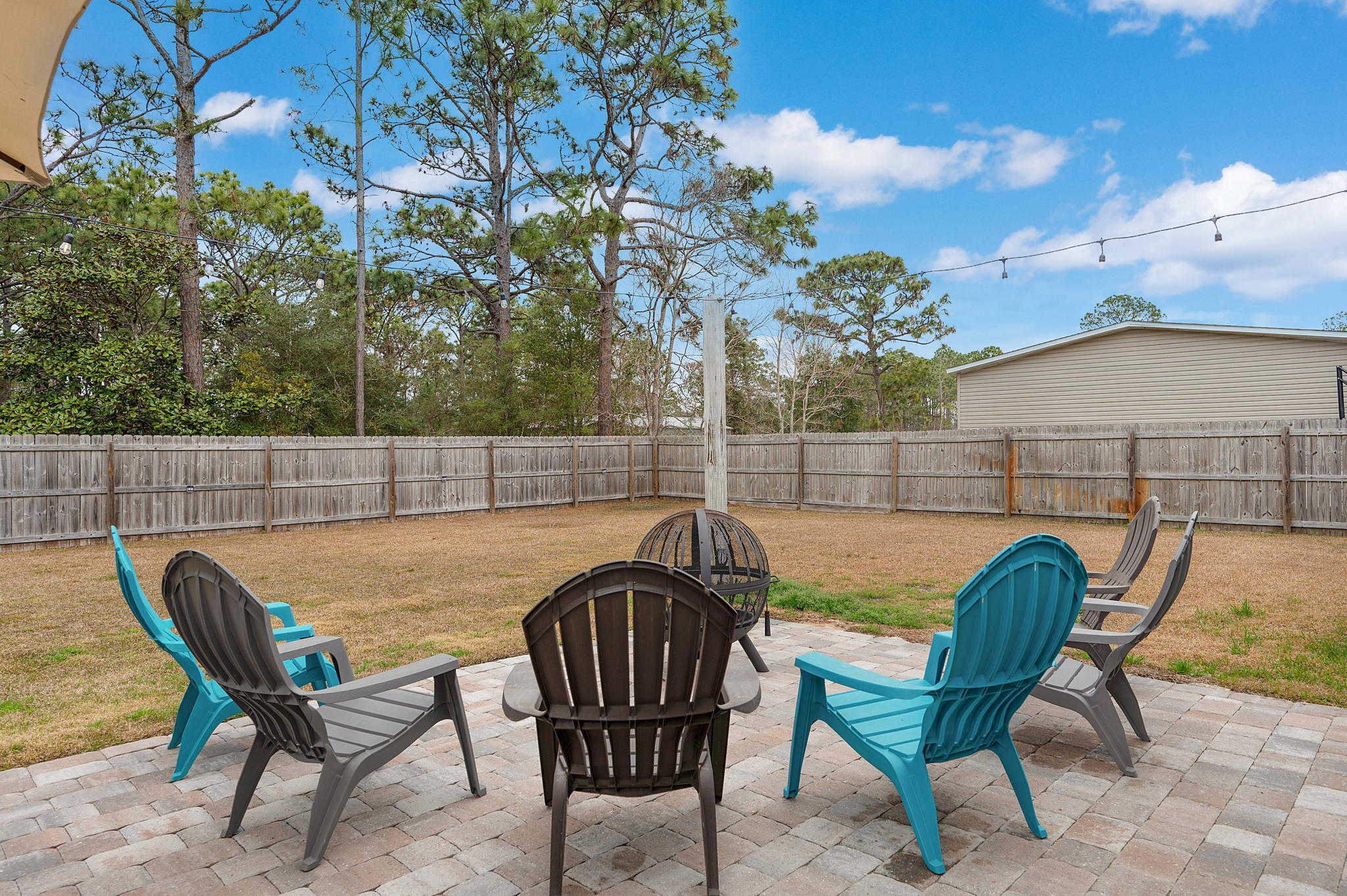 9018 Timber Lane Navarre, FL 32566 - Photo 29 of 39 a view of a chairs and table in the patio