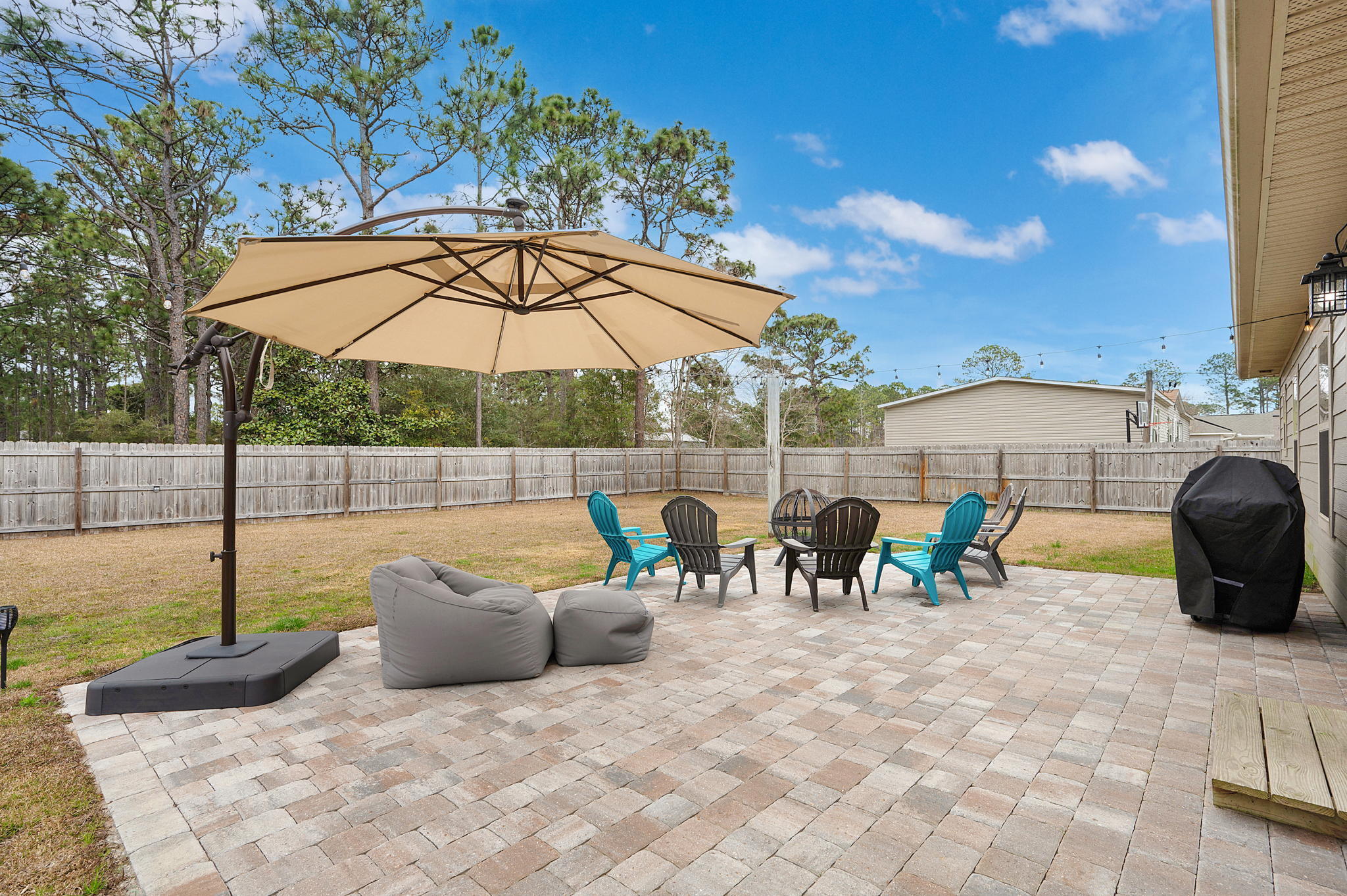 9018 Timber Lane Navarre, FL 32566 - Photo 30 of 39 a view of a swimming pool with a lounge chair