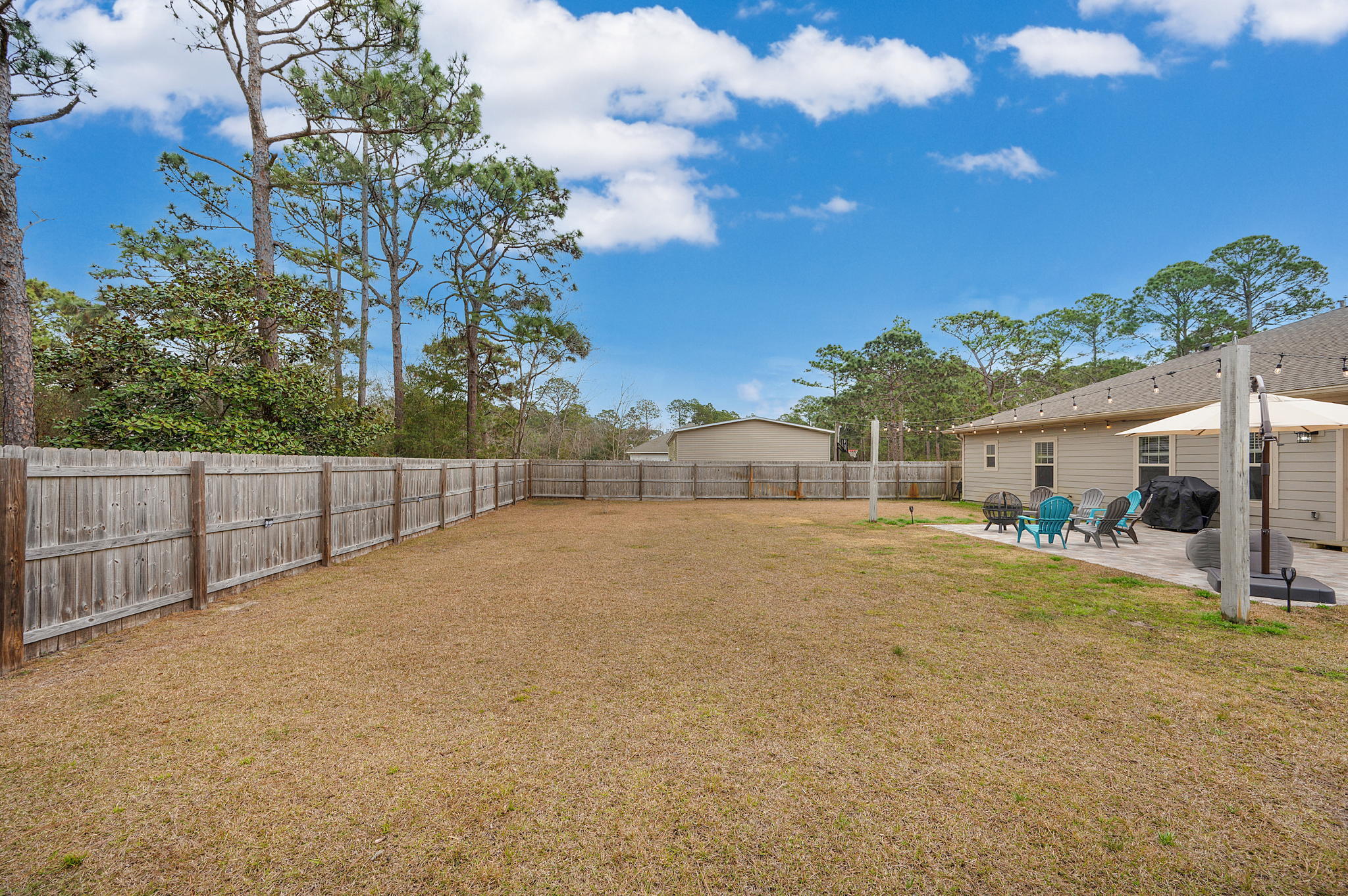 9018 Timber Lane Navarre, FL 32566 - Photo 32 of 39 a view of backyard of house