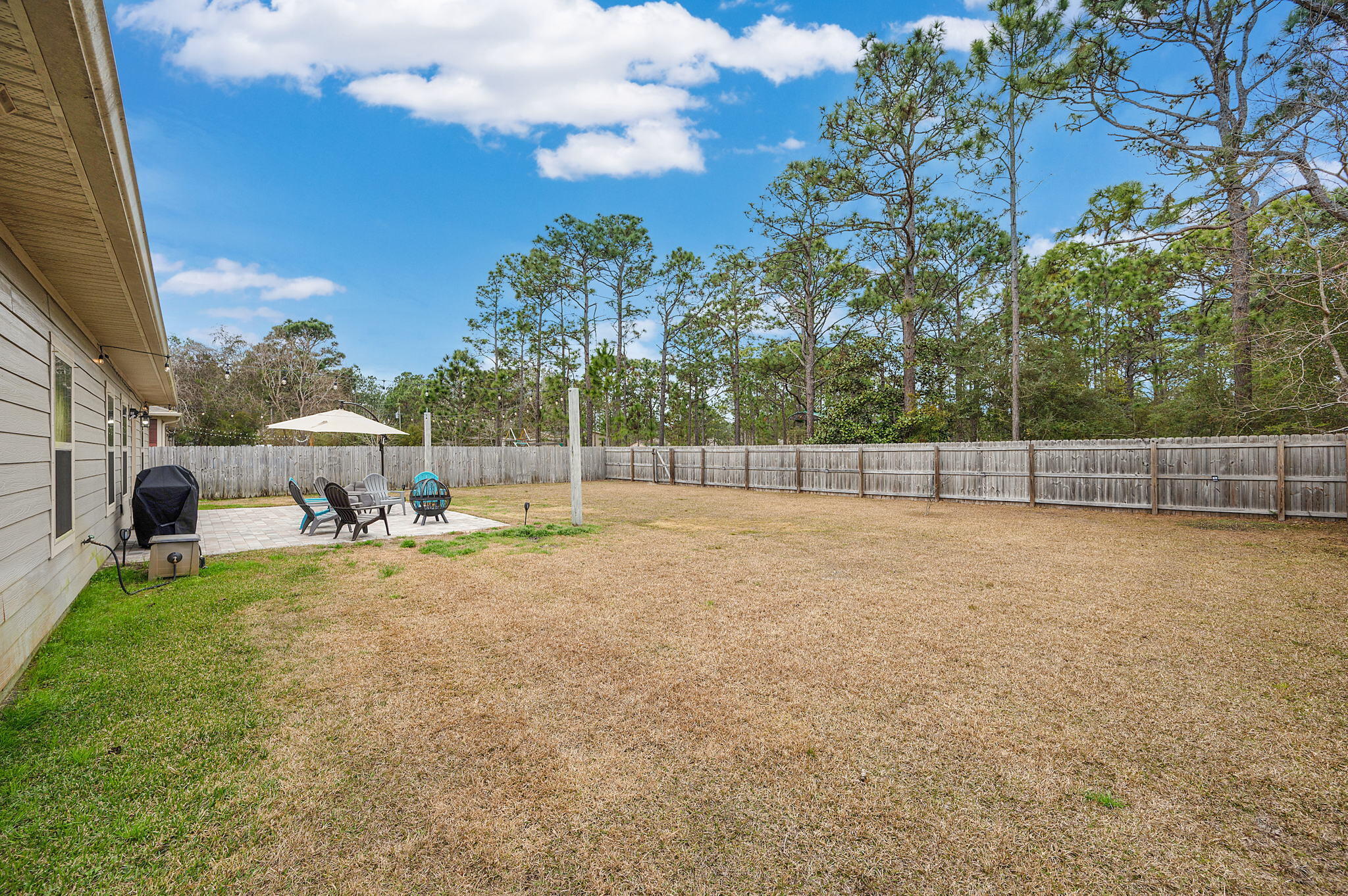 9018 Timber Lane Navarre, FL 32566 - Photo 34 of 39 a view of a garden with a slide