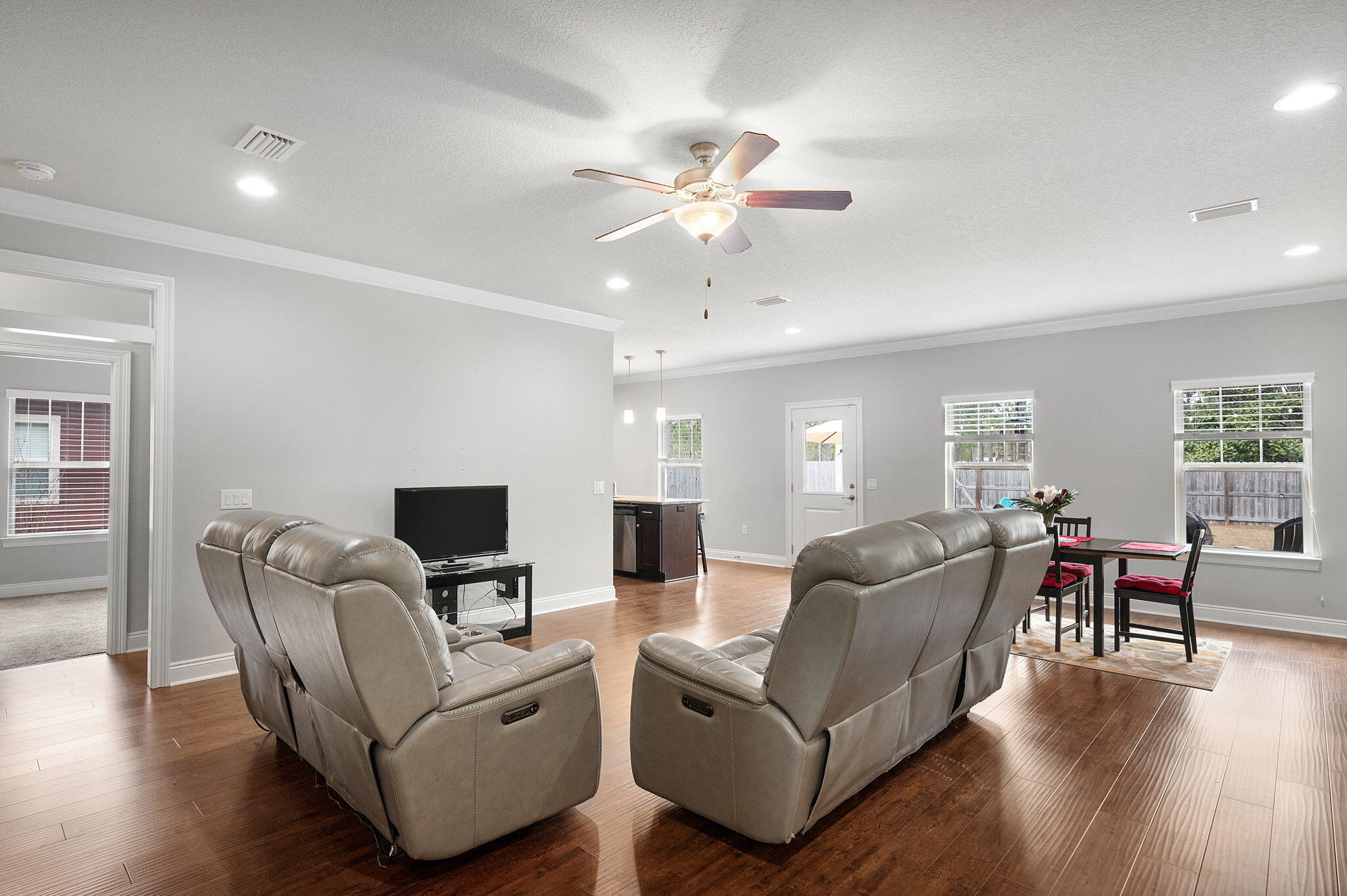9018 Timber Lane Navarre, FL 32566 - Photo 4 of 39 a living room with furniture and a large window