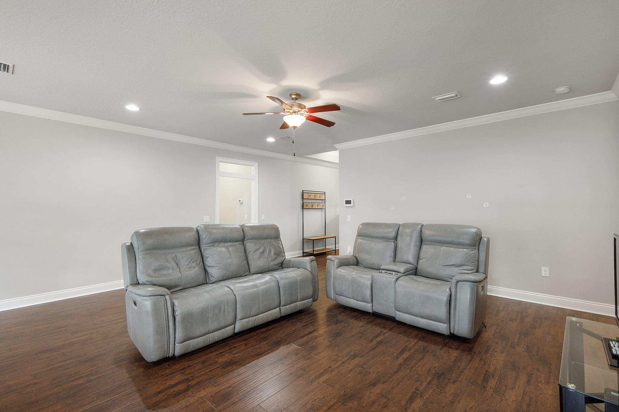 9018 Timber Lane Navarre, FL 32566 - Photo 6 of 39 a living room with furniture and wooden floor