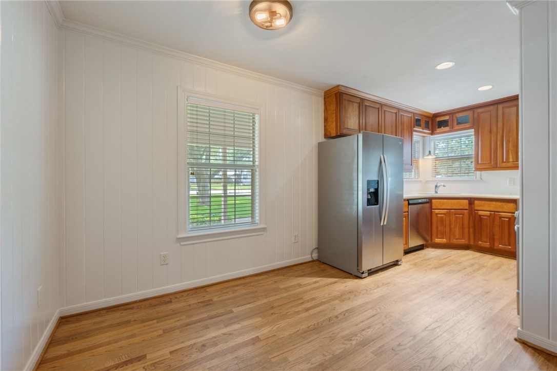 715 Inwood Drive Bryan, TX 77802 - Photo 2 of 34 a view of a kitchen with a refrigerator cabinet and a window