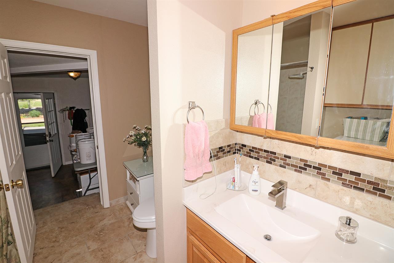 1029 24 Road Grand Junction, CO 81505 - Photo 25 of 42 a bathroom with a sink a toilet and shower