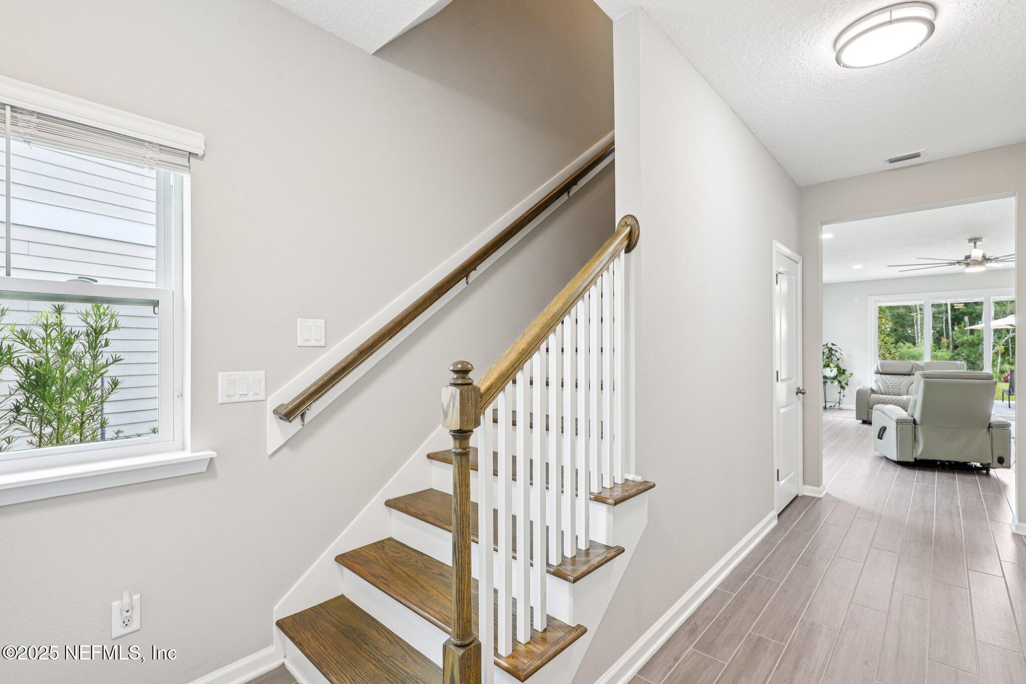 456 Stargaze Lane St. Augustine, FL 32095 - Photo 14 of 40 a view of entryway and hall with wooden floor