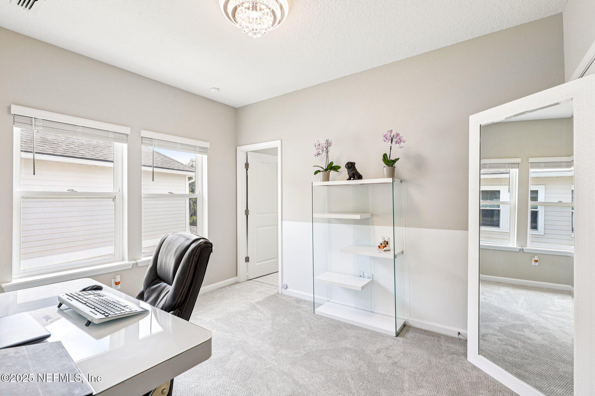 456 Stargaze Lane St. Augustine, FL 32095 - Photo 15 of 40 a view of a livingroom with furniture and a window