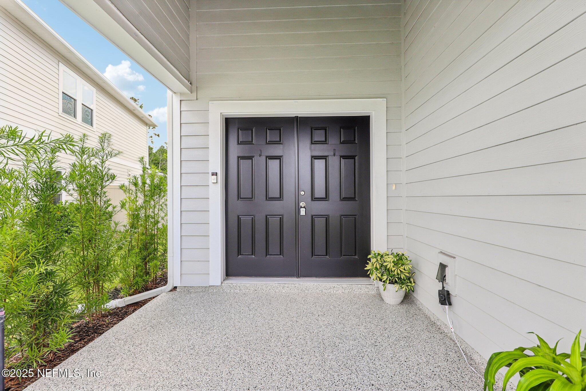 456 Stargaze Lane St. Augustine, FL 32095 - Photo 2 of 40 a front view of a house with a yard
