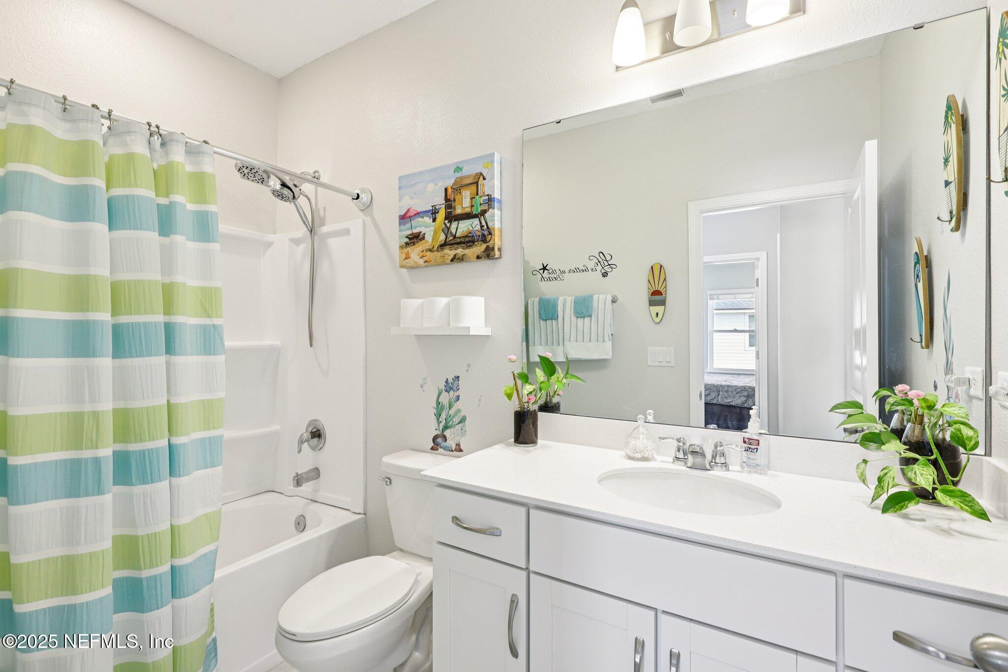 456 Stargaze Lane St. Augustine, FL 32095 - Photo 23 of 40 a bathroom with a sink toilet and shower