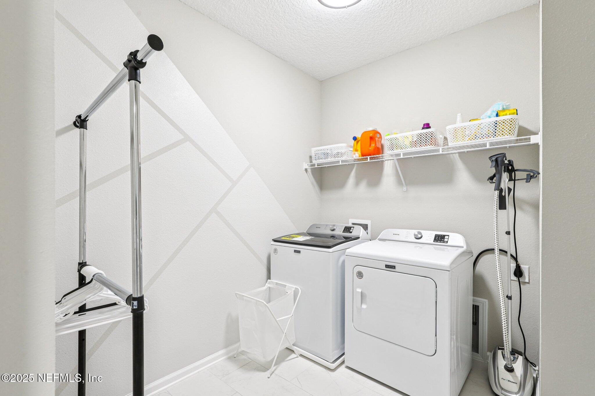 456 Stargaze Lane St. Augustine, FL 32095 - Photo 24 of 40 a utility room with dryer and washer