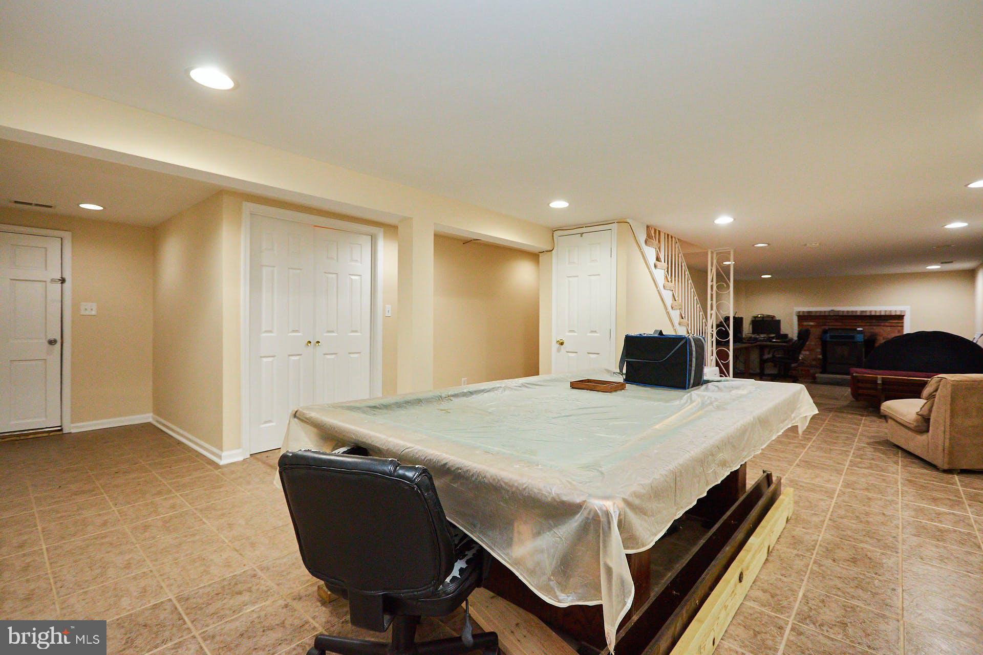 8104 Sinclair Mill Road Manassas, VA 20112 - Photo 22 of 31 Basement rec room with tile floor
