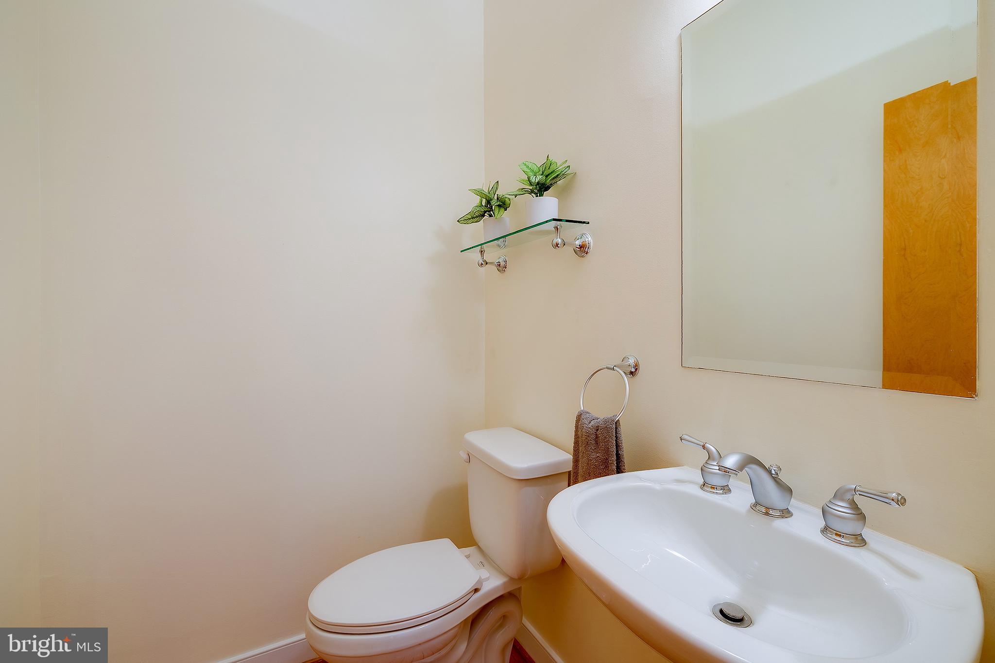 2363 Champlain Street Northwest, Unit 20 Washington, DC 20009 - Photo 11 of 29 a bathroom with a sink a toilet and a mirror