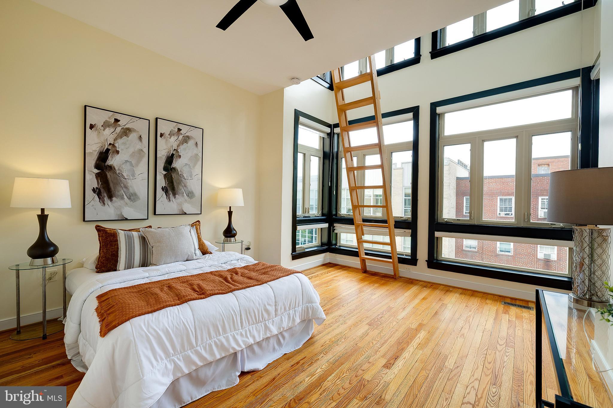 2363 Champlain Street Northwest, Unit 20 Washington, DC 20009 - Photo 12 of 29 a bedroom with furniture and a large window