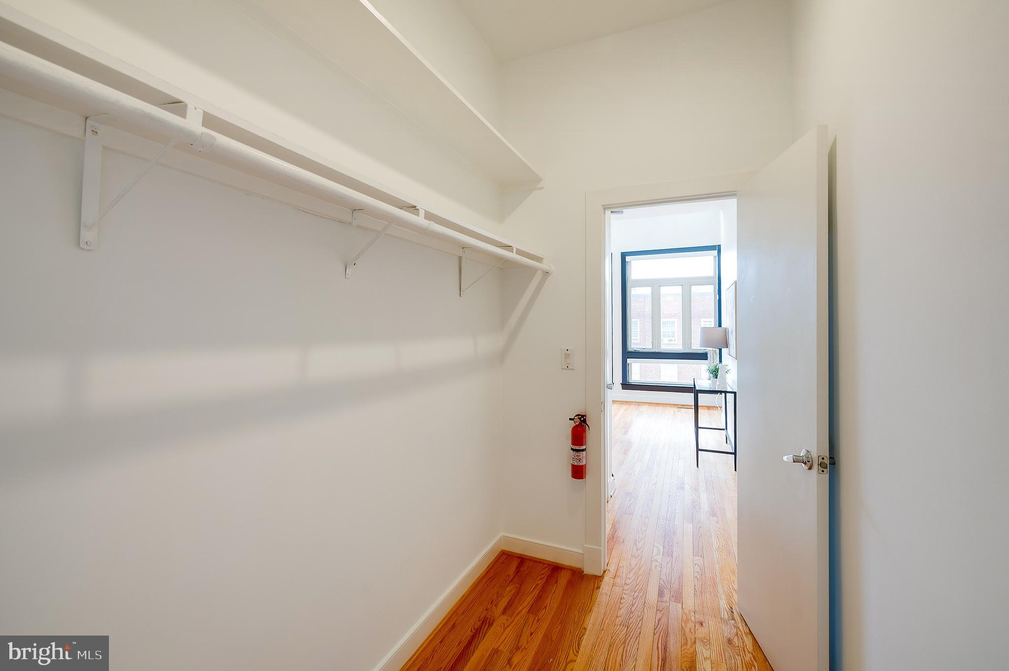 2363 Champlain Street Northwest, Unit 20 Washington, DC 20009 - Photo 17 of 29 a room with wooden floor and windows