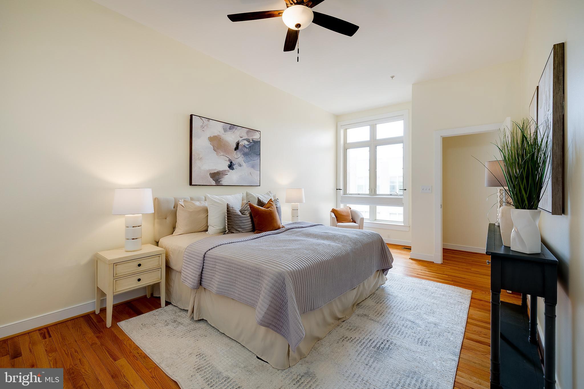 2363 Champlain Street Northwest, Unit 20 Washington, DC 20009 - Photo 20 of 29 a bedroom with a bed and wooden floor