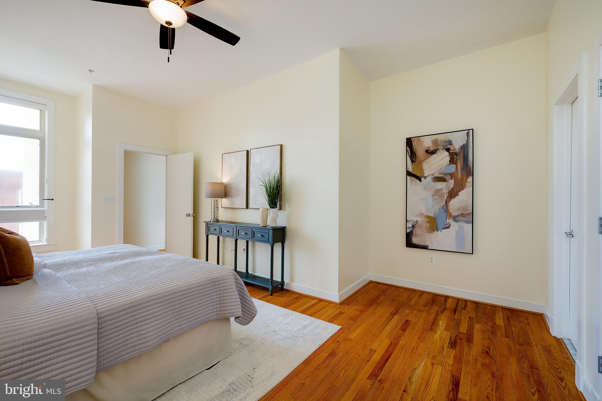 2363 Champlain Street Northwest, Unit 20 Washington, DC 20009 - Photo 22 of 29 a bedroom with a bed and a painting on the wall