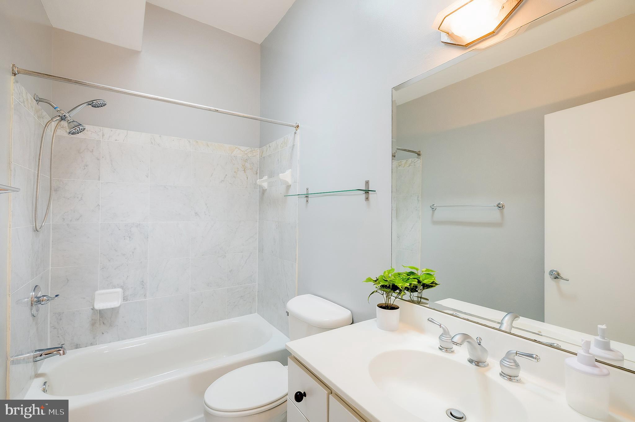 2363 Champlain Street Northwest, Unit 20 Washington, DC 20009 - Photo 23 of 29 a bathroom with a sink toilet and a bathtub
